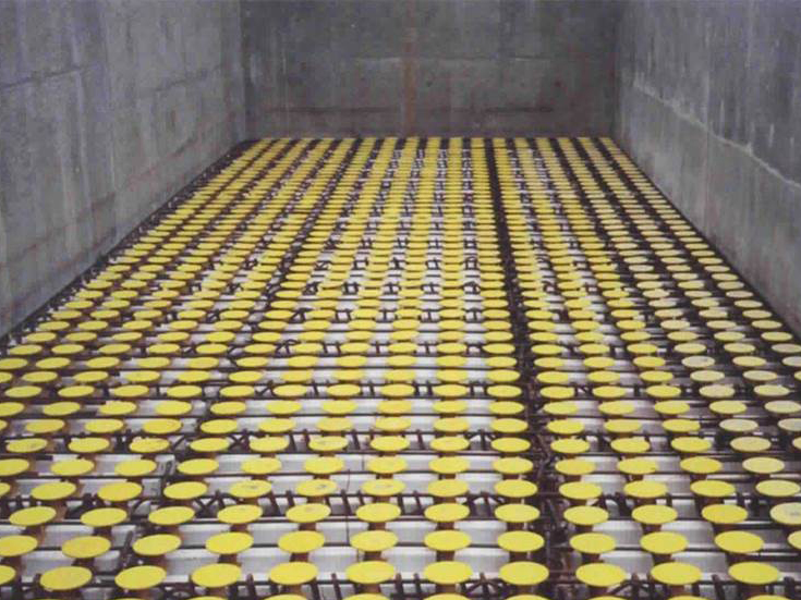 Plastic seating plates inserted on each nozzle inserted into CastKleen® Underdrain